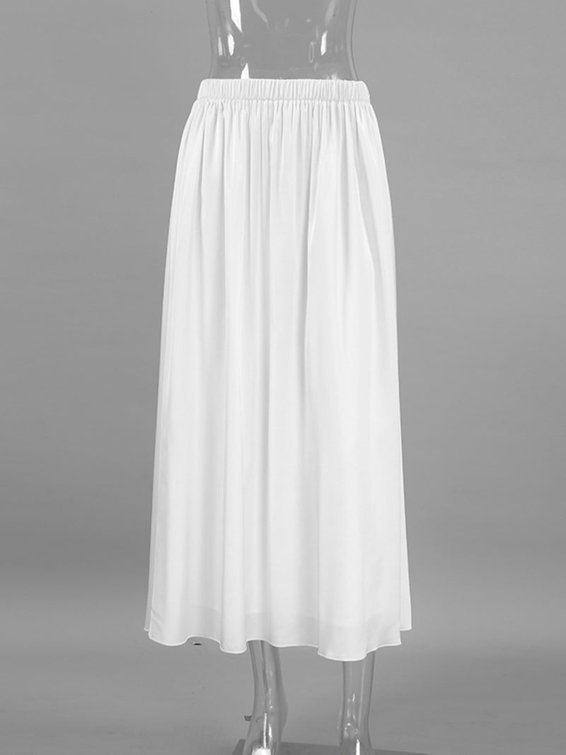 White skirt on a mannequin against a gray background