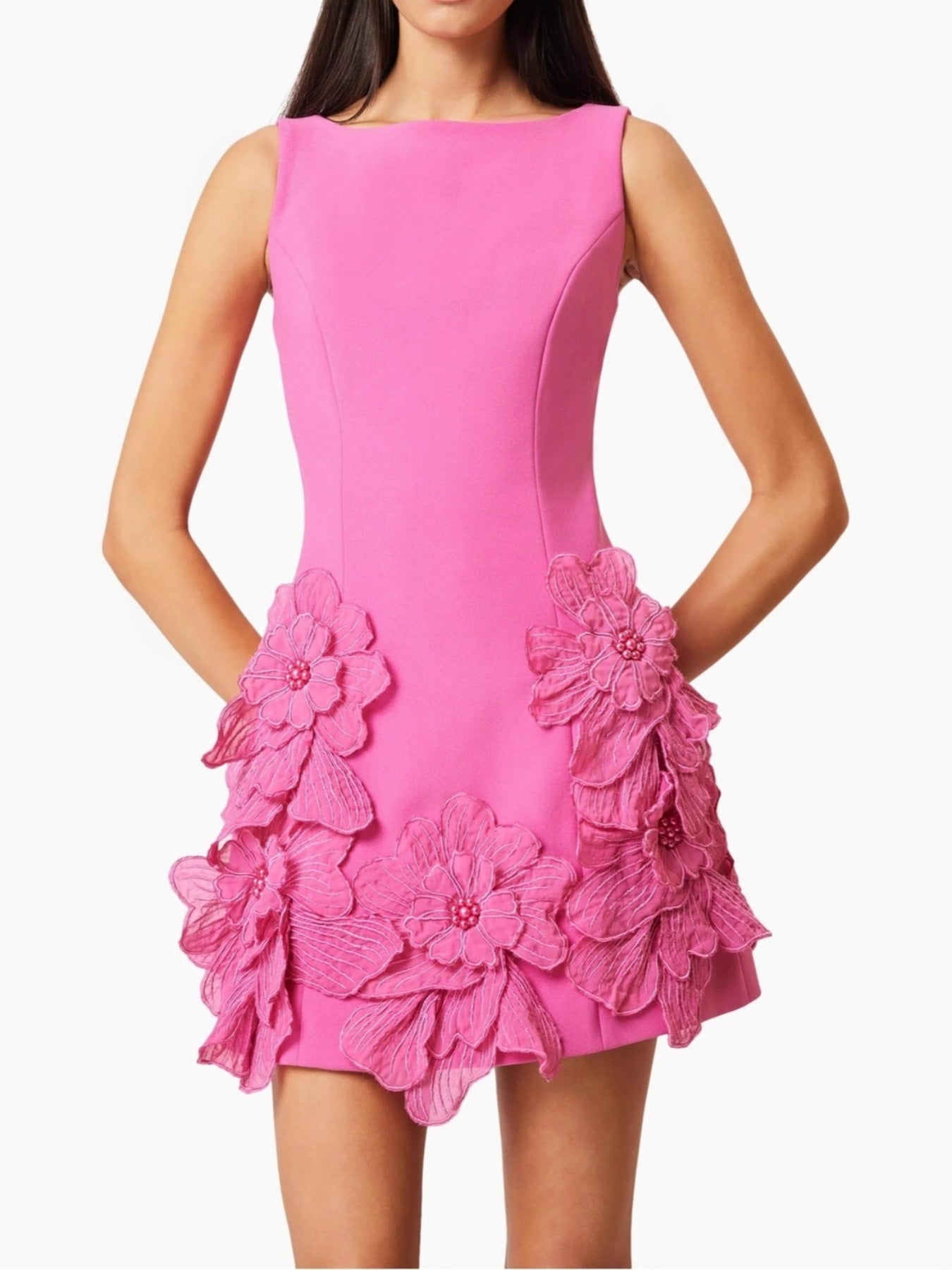 Pink dress with floral embellishments on a white background