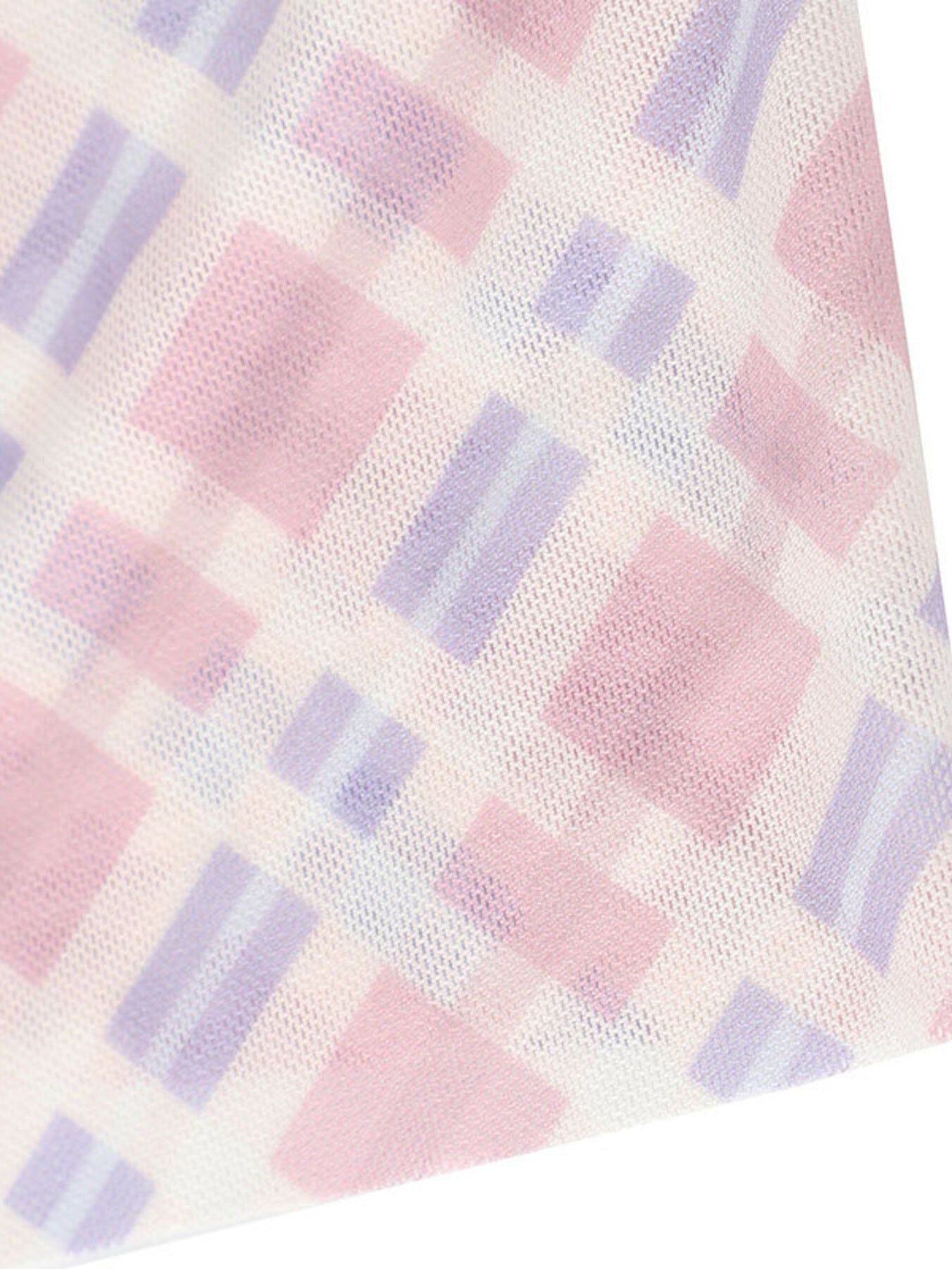 Close-up of a checkered fabric with pink and purple squares on a white background
