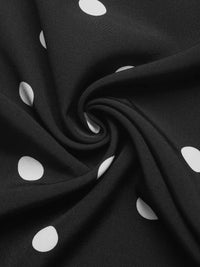 Black fabric with white polka dots