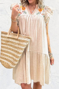 Another front view of woman in a beige dress