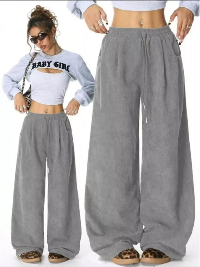 Gray wide-leg pants worn by a person on a white background