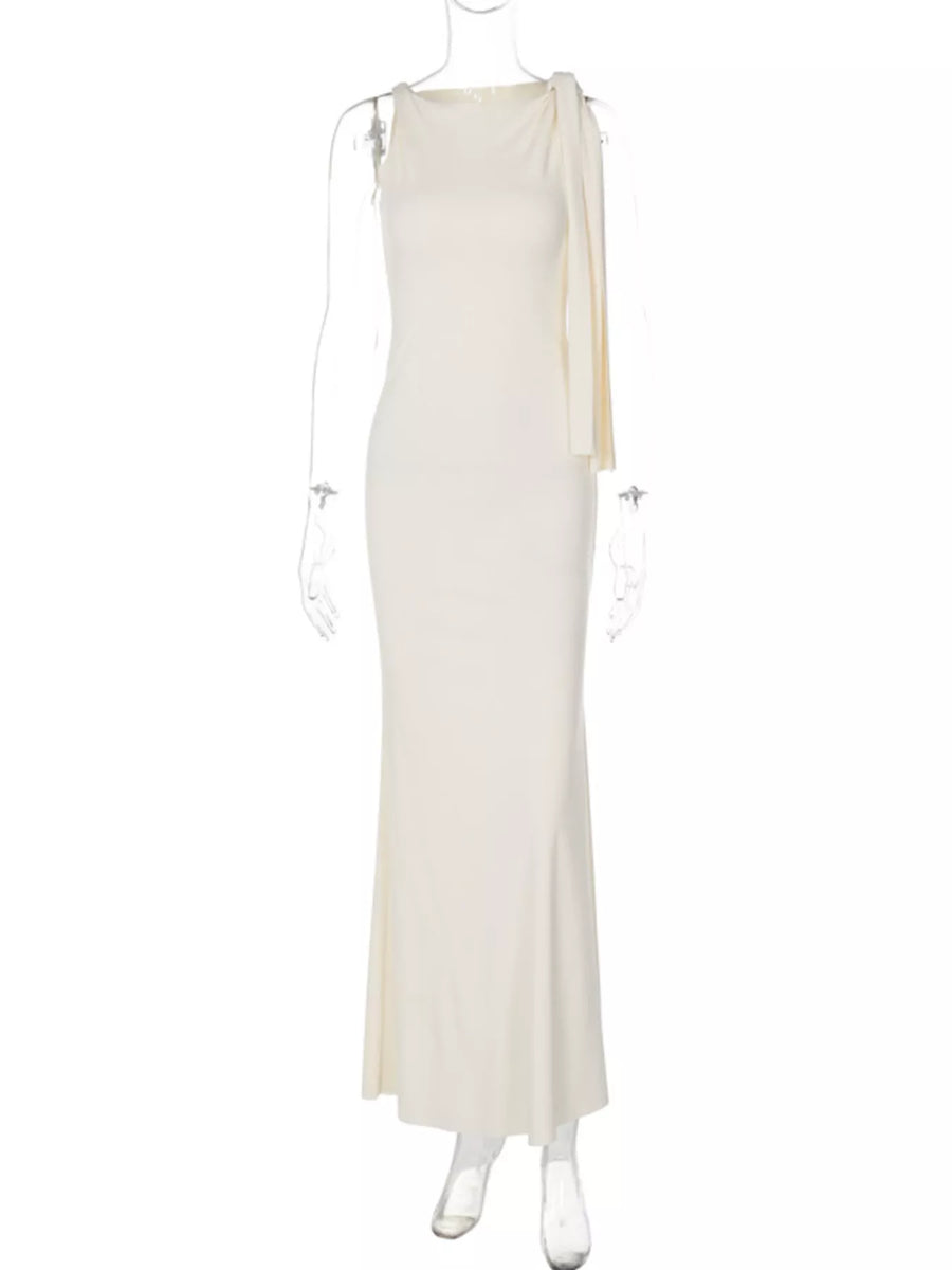White evening gown on a mannequin against a white background