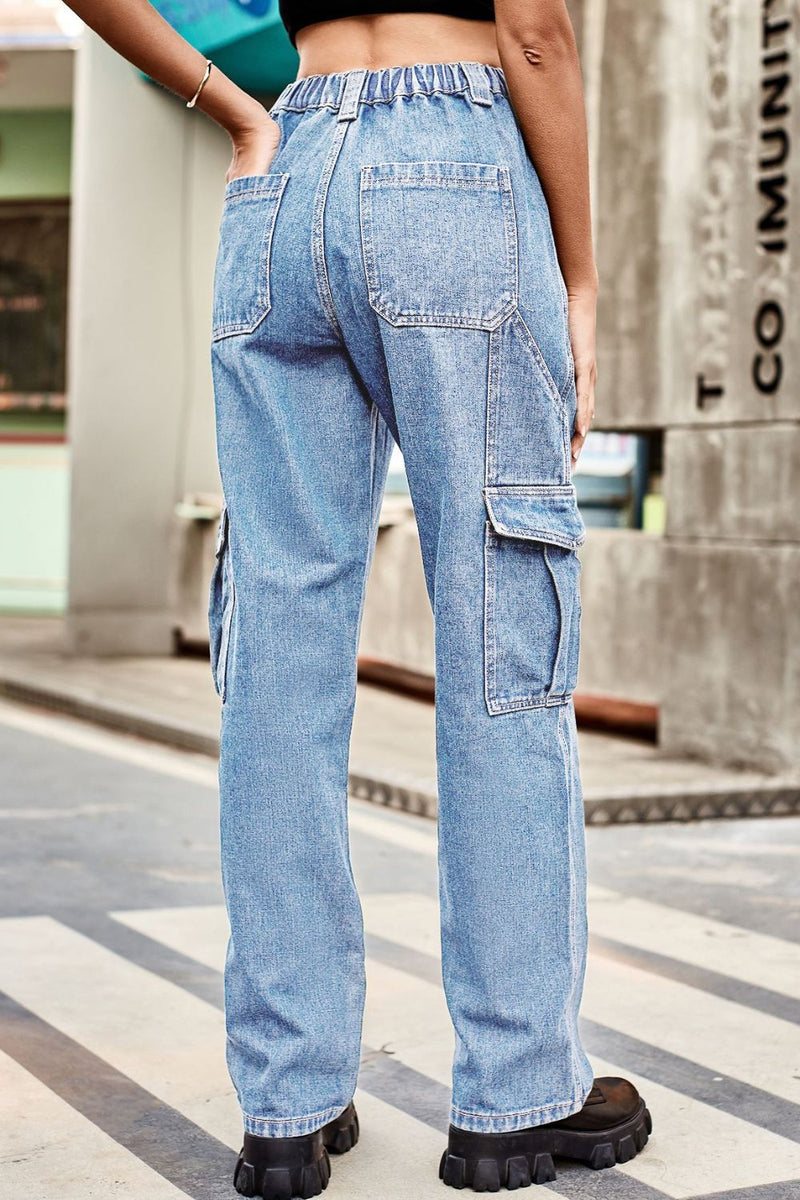 Person wearing light blue cargo jeans on a city street.