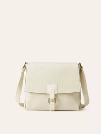 Beige shoulder bag on a light beige background