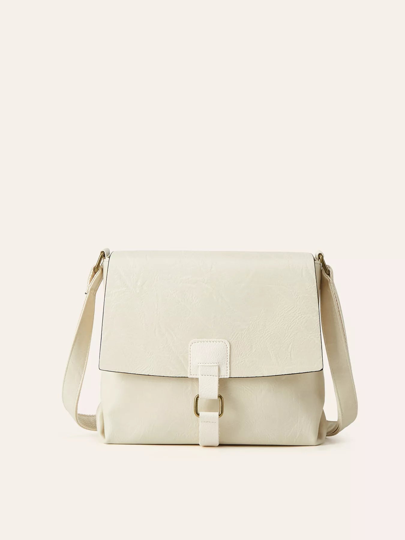 Beige shoulder bag on a light beige background
