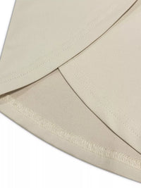 Close-up of a beige envelope with a decorative ribbon.