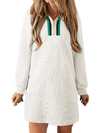 White long-sleeve dress with a textured pattern on a white background