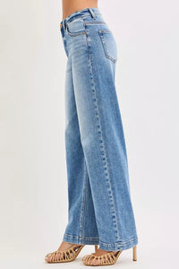Light blue jeans worn by a person on a white background