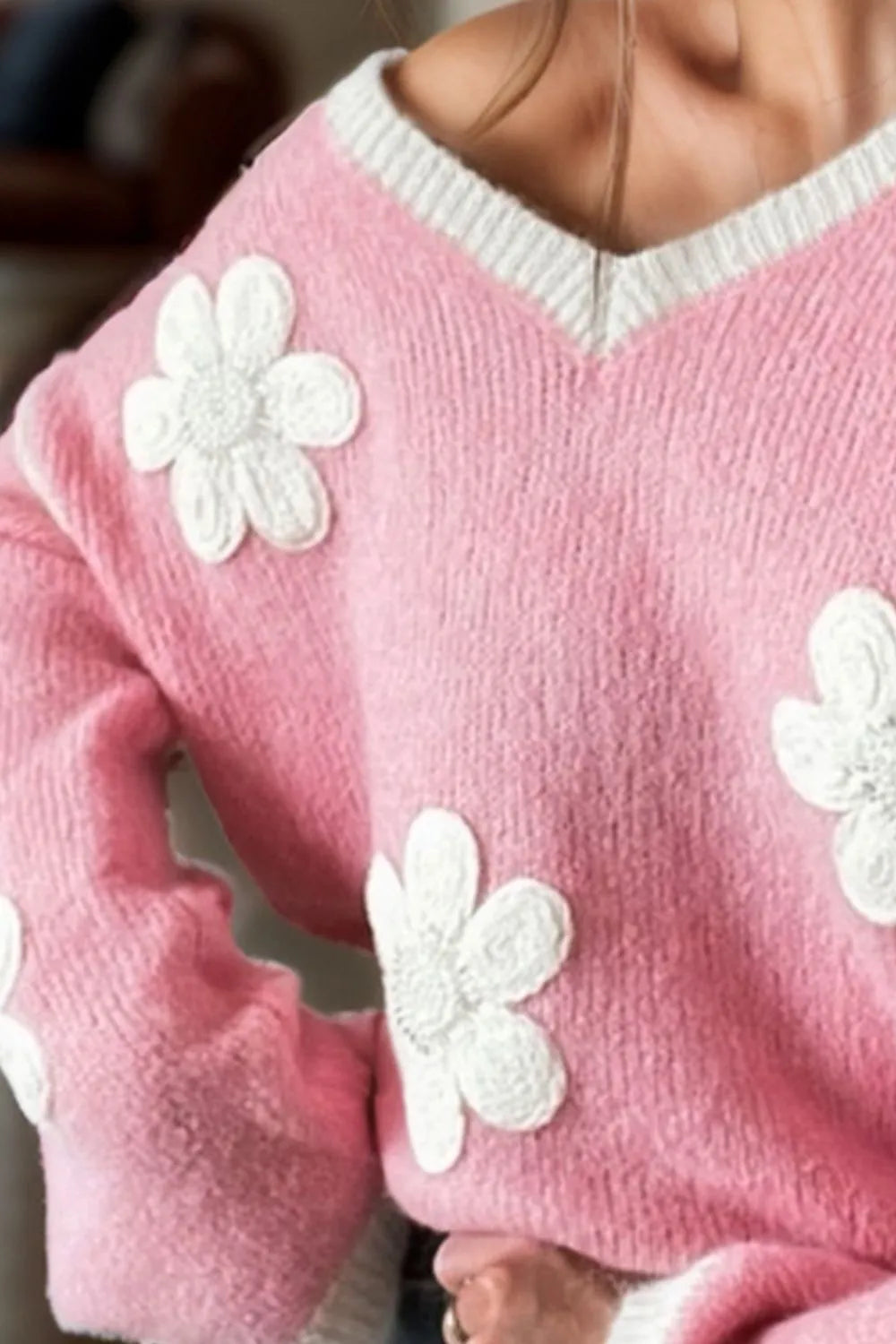 Pink sweater with white flower patterns