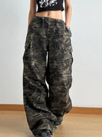 Camouflage cargo pants worn by a person on a plain background