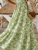 Person wearing a floral dress in an indoor setting with wooden furniture.