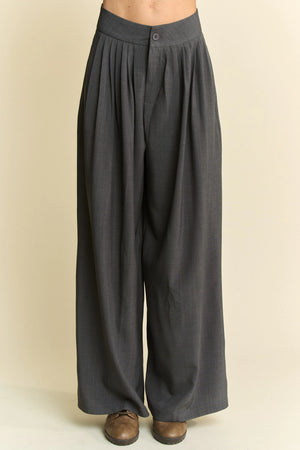 Dark gray wide-leg pants on a beige background