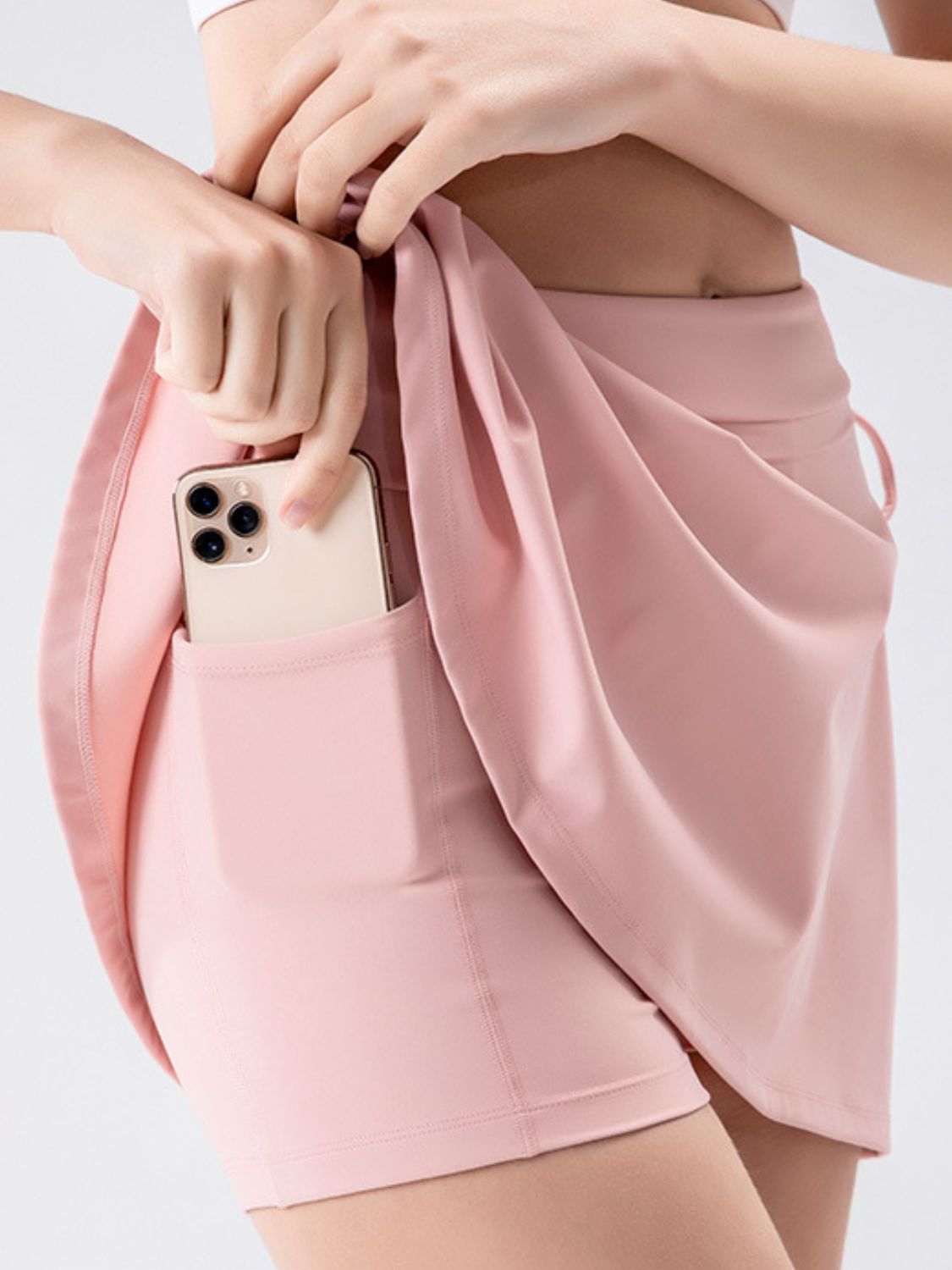 View of pocket on pink High Waist Active Skort with Pockets