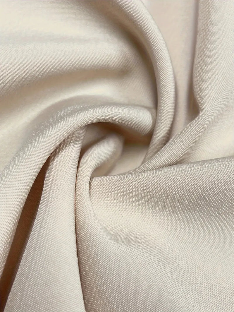 Close-up of beige fabric with folds