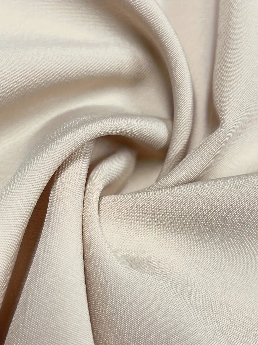 Close-up of beige fabric with folds