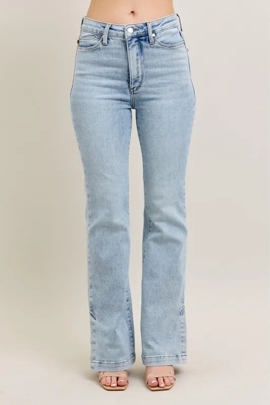Light blue jeans on a beige background