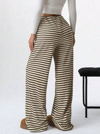 Person wearing striped pants on a white background