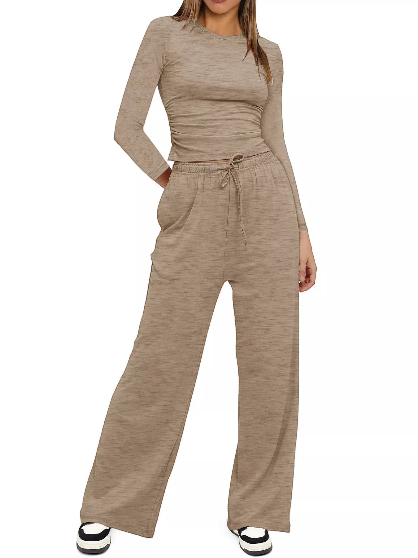 Beige jumpsuit worn by a person on a white background