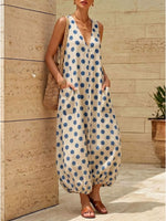 Woman standing in a building wearing Polka Dot V-Neck Sleeveless Maxi Dress