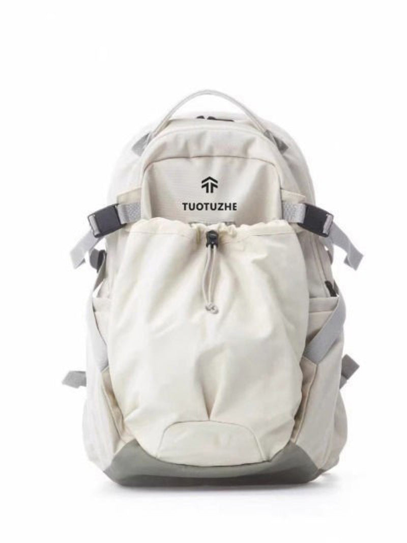 White backpack with black straps on a white background