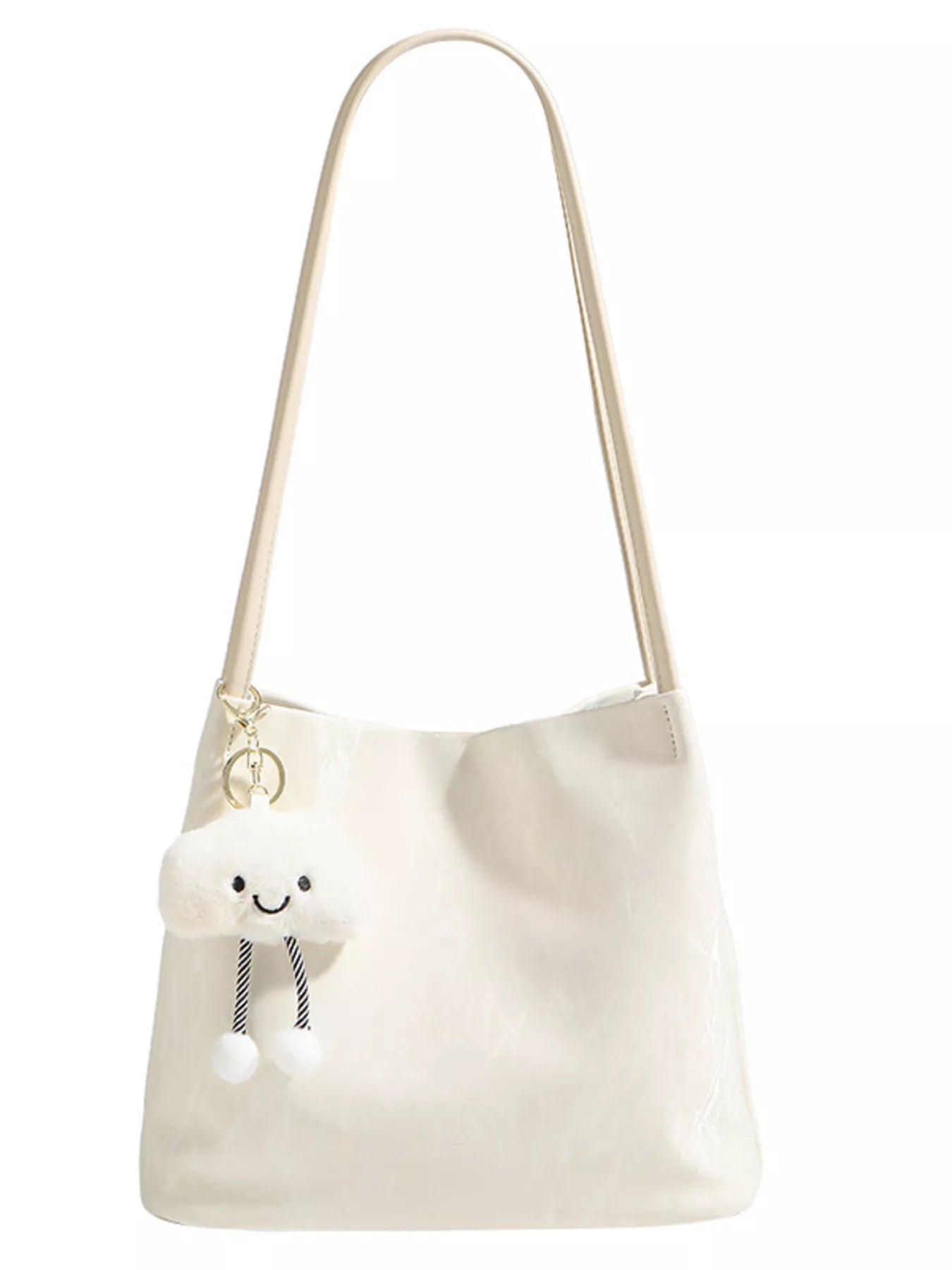 White shoulder bag with a plush toy on a white background