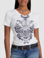 Person wearing a white t-shirt with black intricate design, paired with blue jeans and a black belt.
