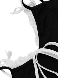 Black swimsuit with white lace trim on a white background