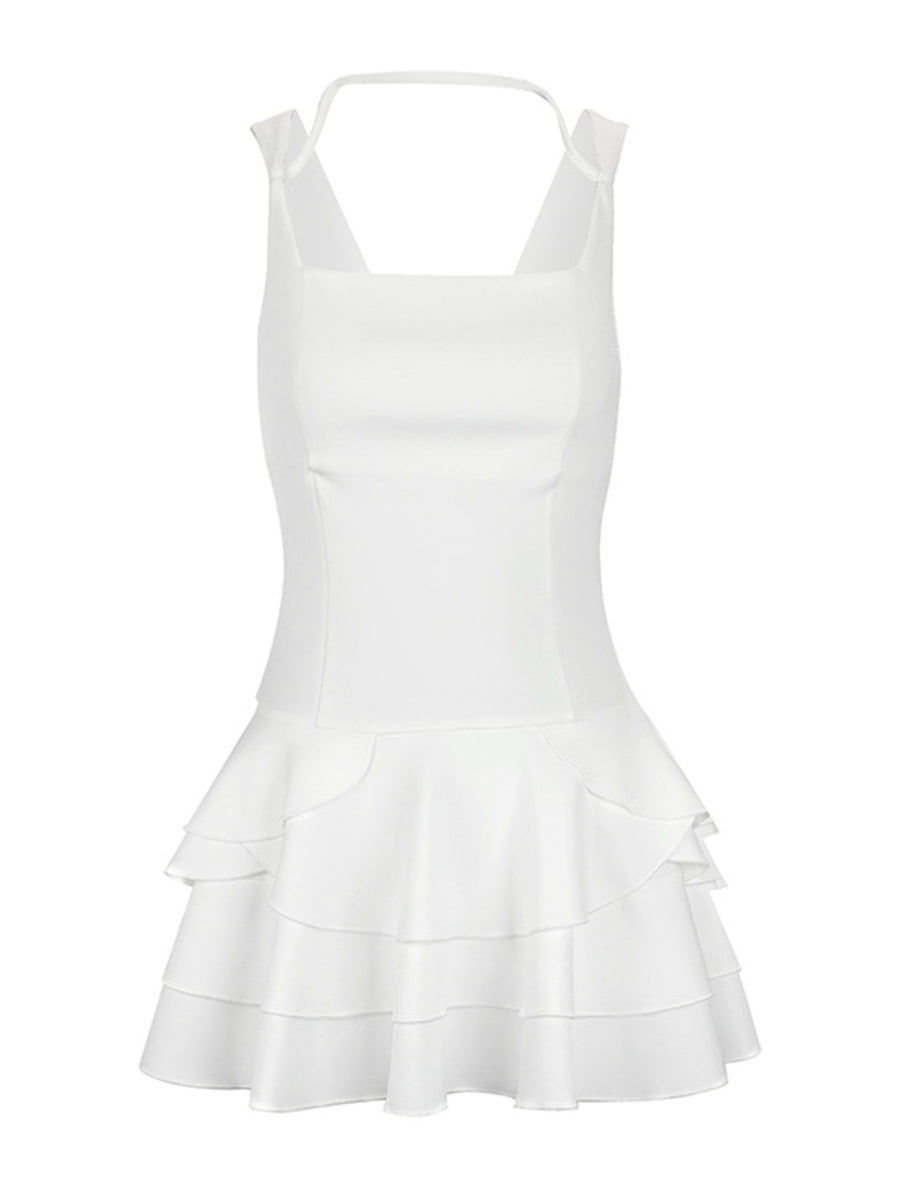 White dress with ruffled layers on a white background