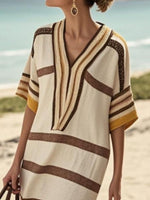 Close up brown and beige striped dress