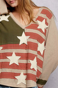 Person wearing a shirt with American flag design and stars