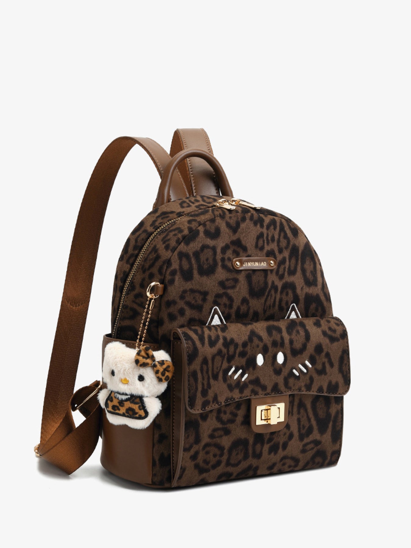 Leopard print backpack with a small plush toy attached on a white background