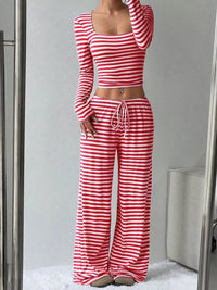 Red and white striped long-sleeve top and wide-leg pants set on a neutral background