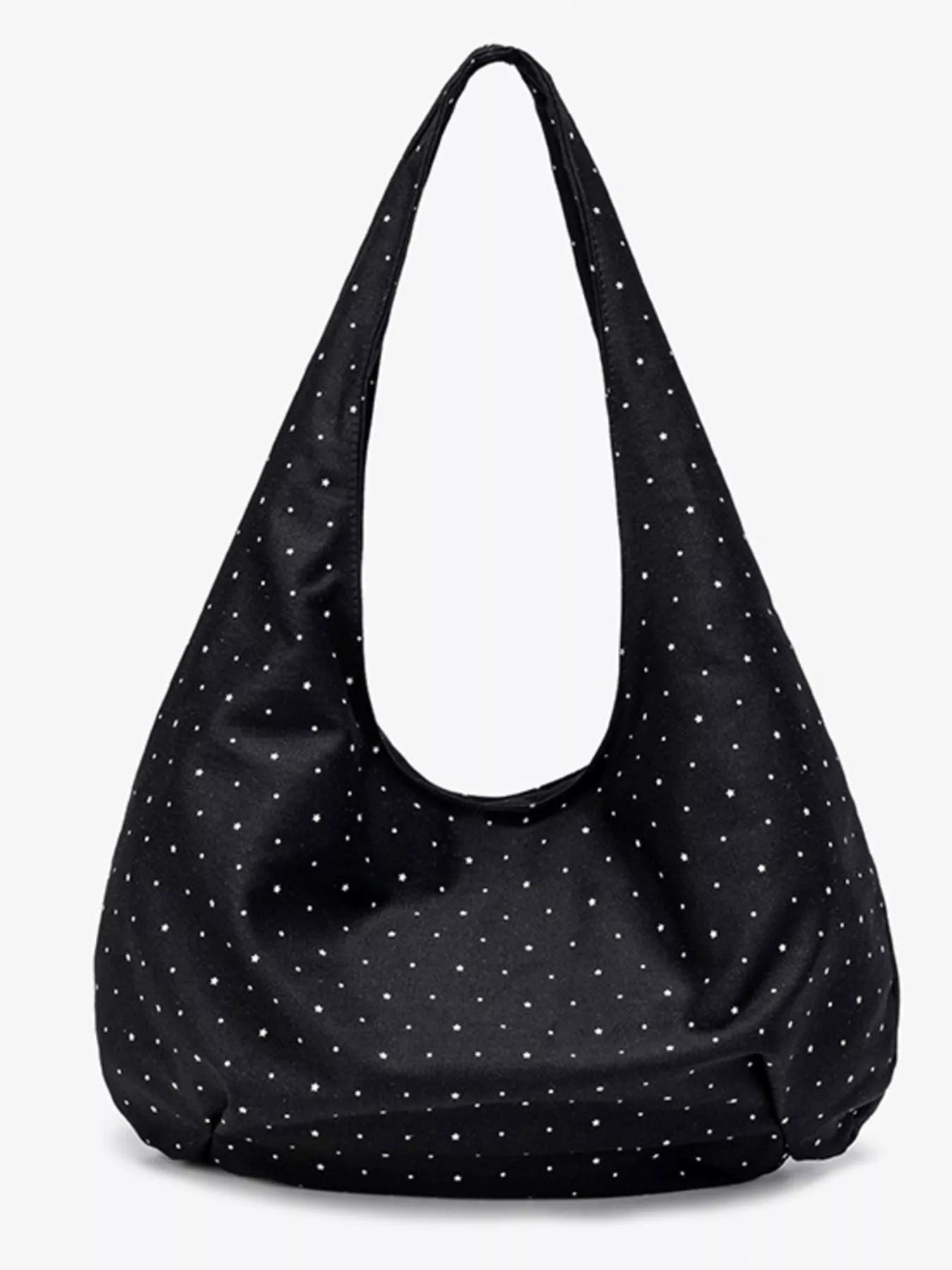 Black shoulder bag with white polka dots on a white background