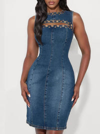 Blue denim dress with floral lace details on a white background
