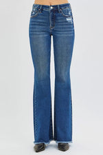 Blue flared jeans on a white background