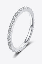 Silver ring with small diamonds on a white background