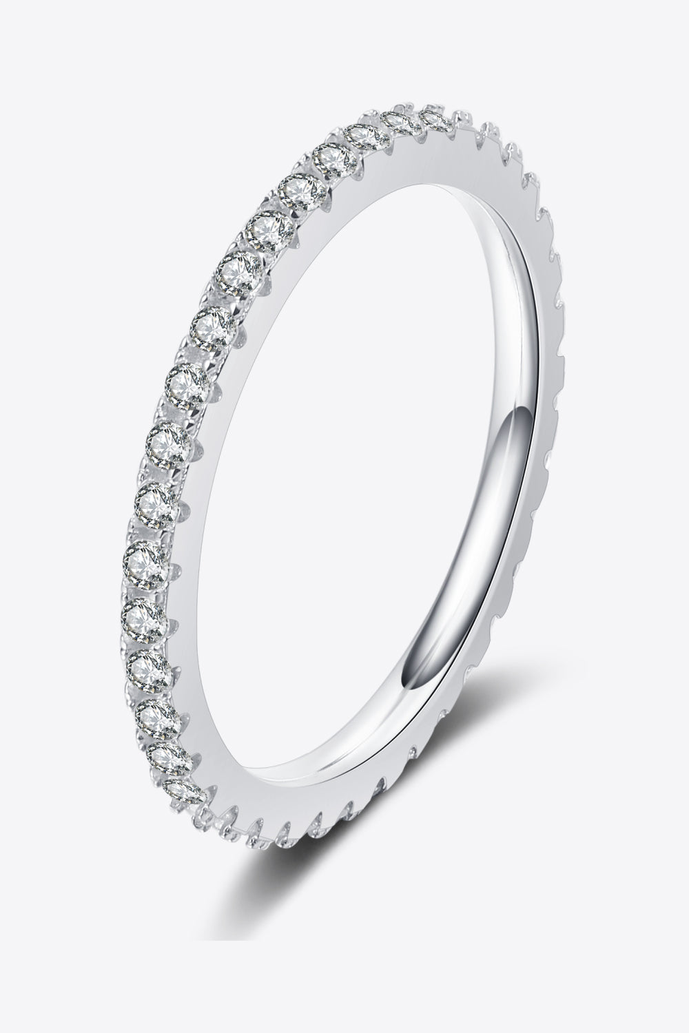 Silver ring with small diamonds on a white background