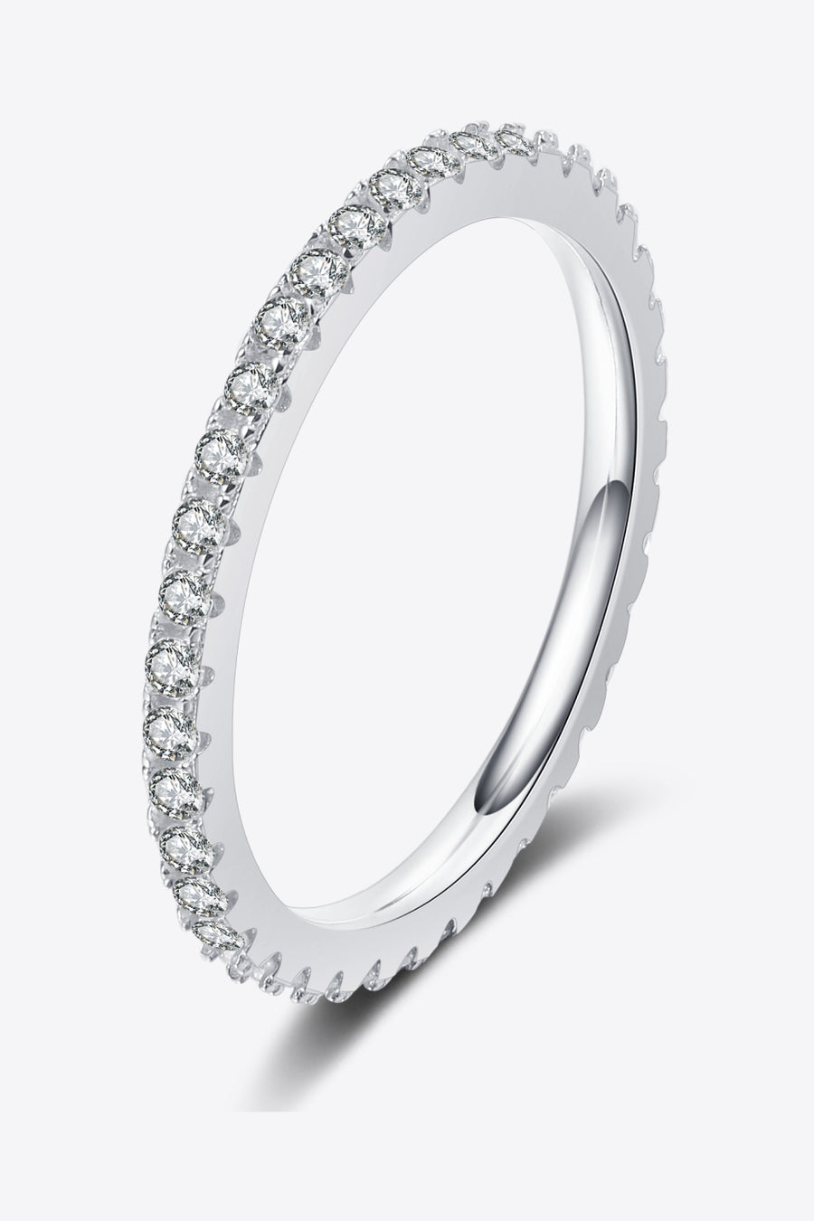 Silver ring with small diamonds on a white background