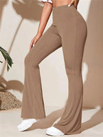 Brown ribbed pants worn by a person on a neutral background