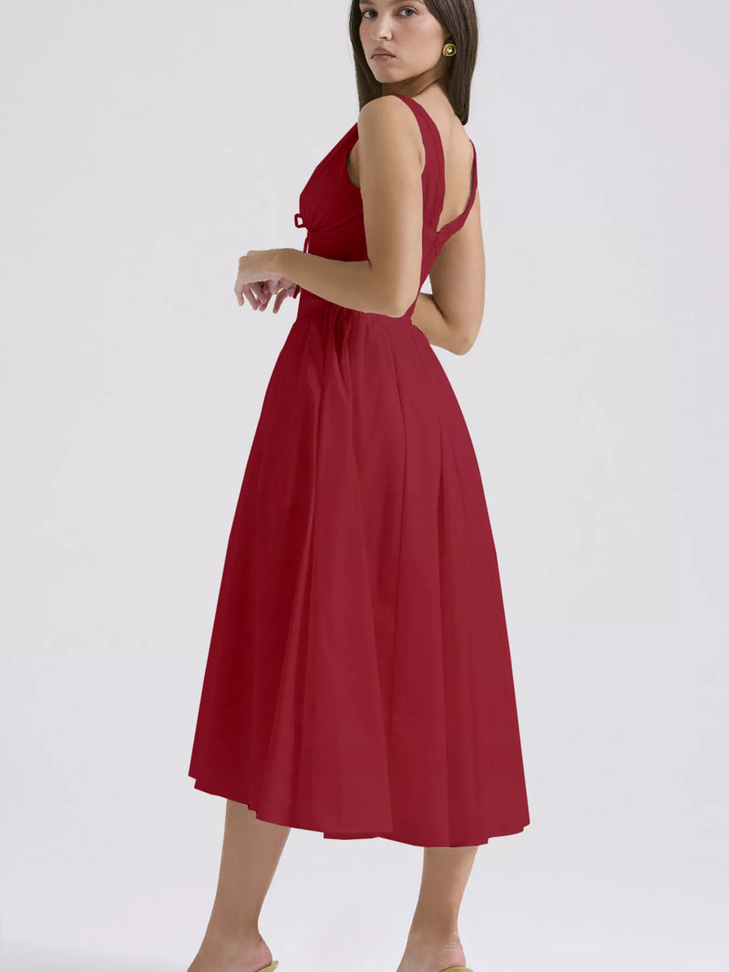 Red dress worn by a model on a white background