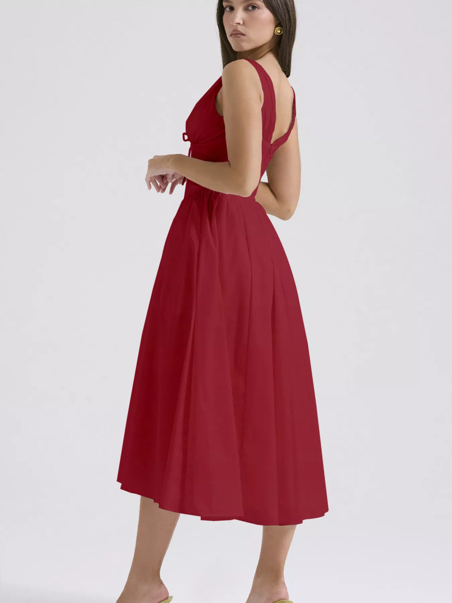 Red dress worn by a model on a white background