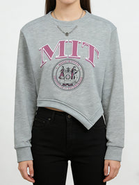 Gray sweatshirt with MIT logo worn by a person on a white background