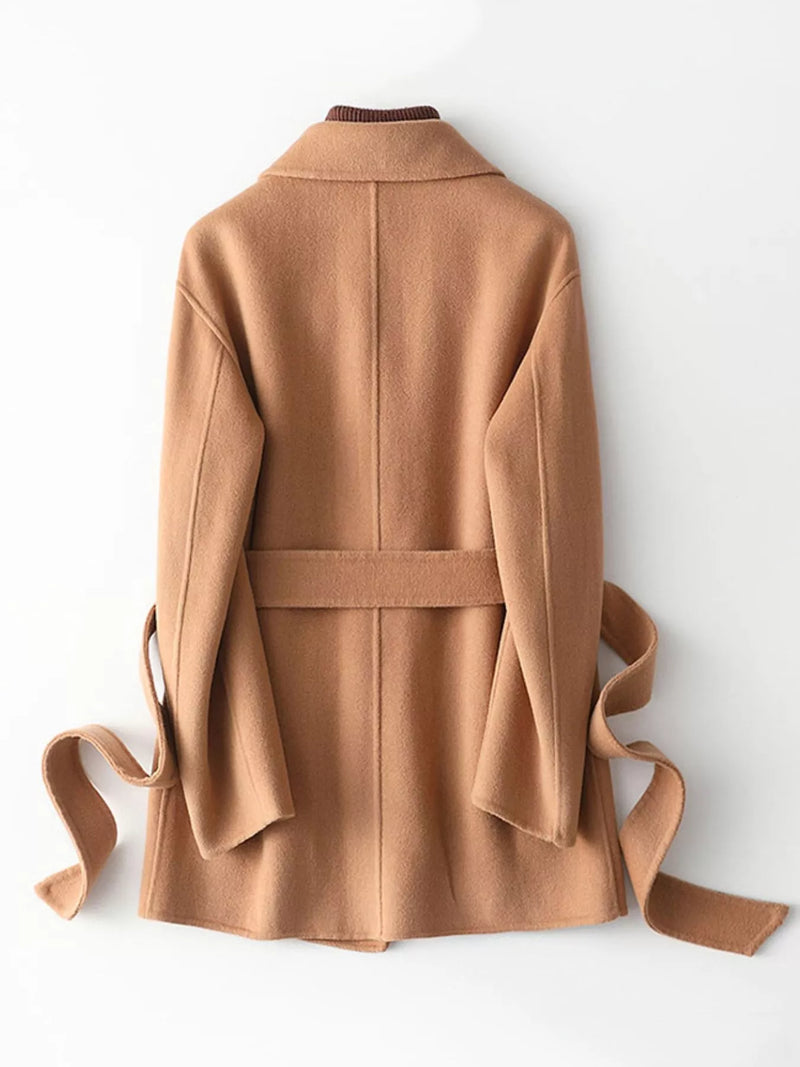 A camel brown wool coat with a matching waist tie belt, shown from the back against a clean white background.
