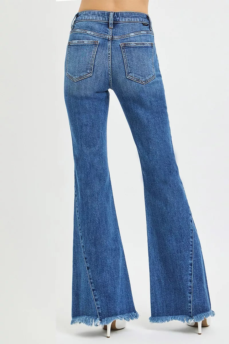 Blue flared jeans on a white background
