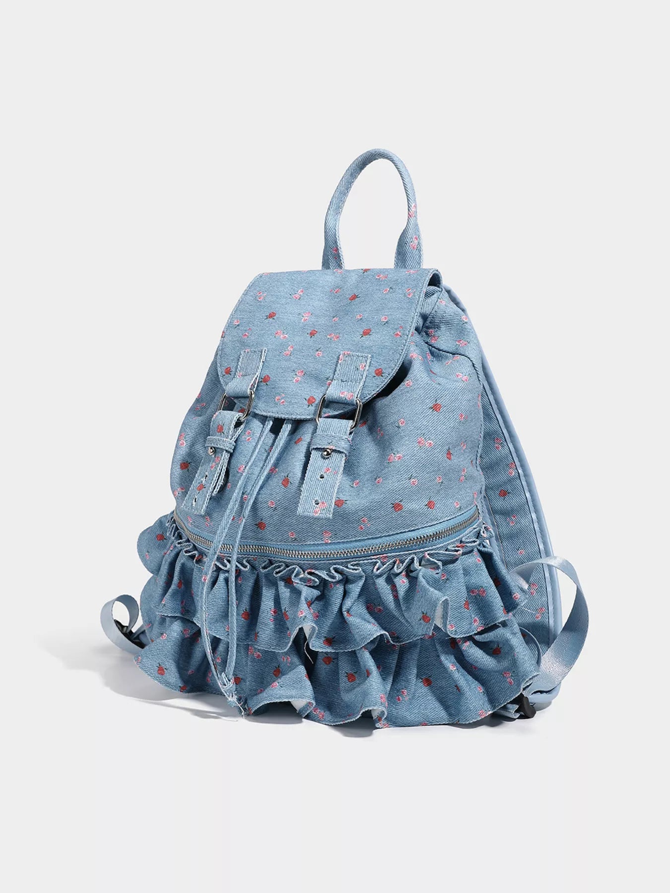 Light blue denim backpack with ruffled bottom on a white background