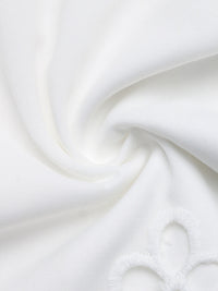 Close-up of white fabric with a subtle texture