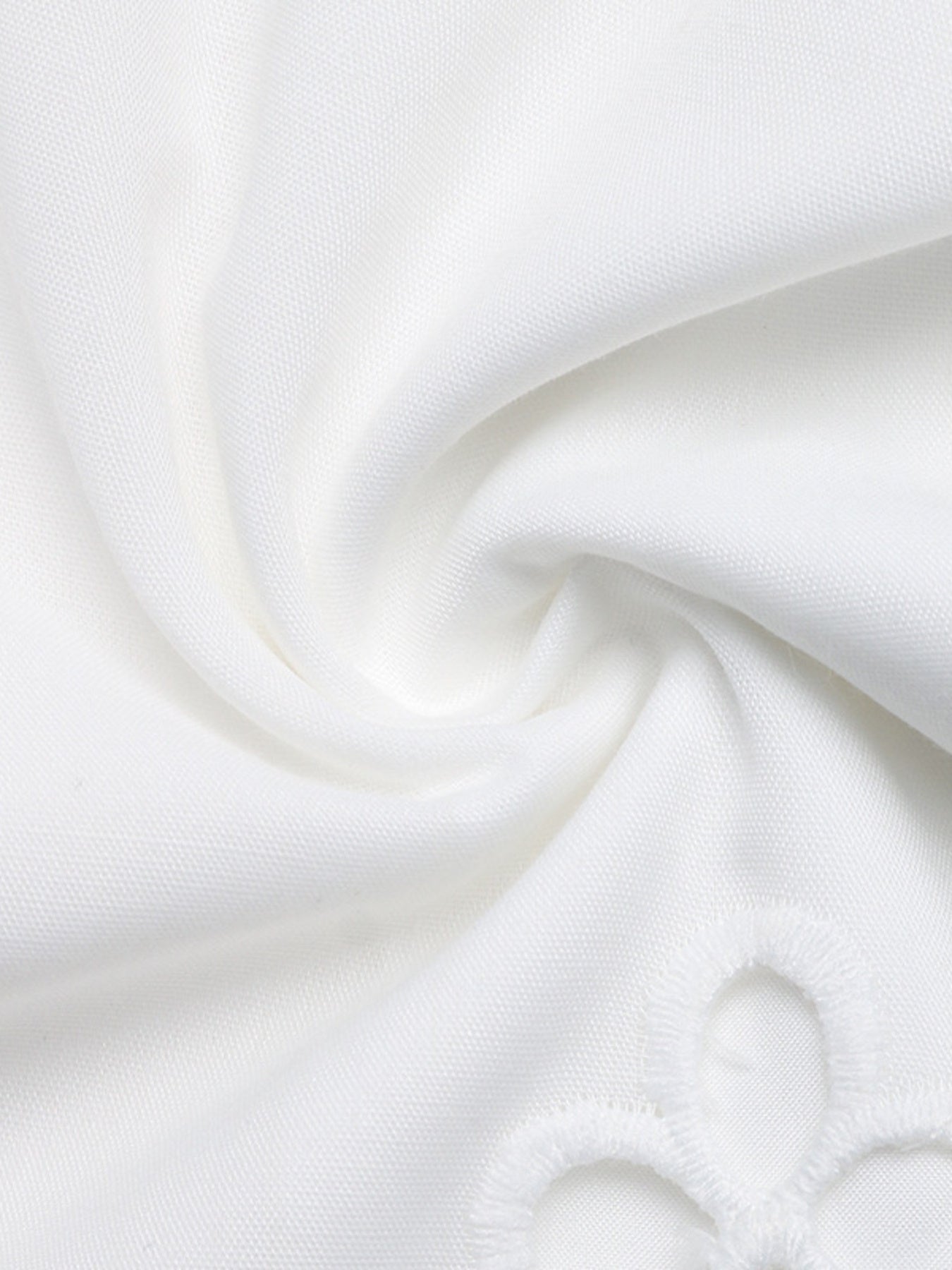 Close-up of white fabric with a subtle texture