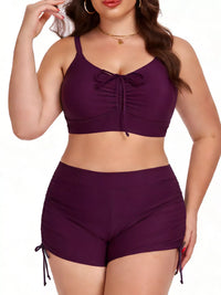 Woman wearing a purple bikini set on a white background