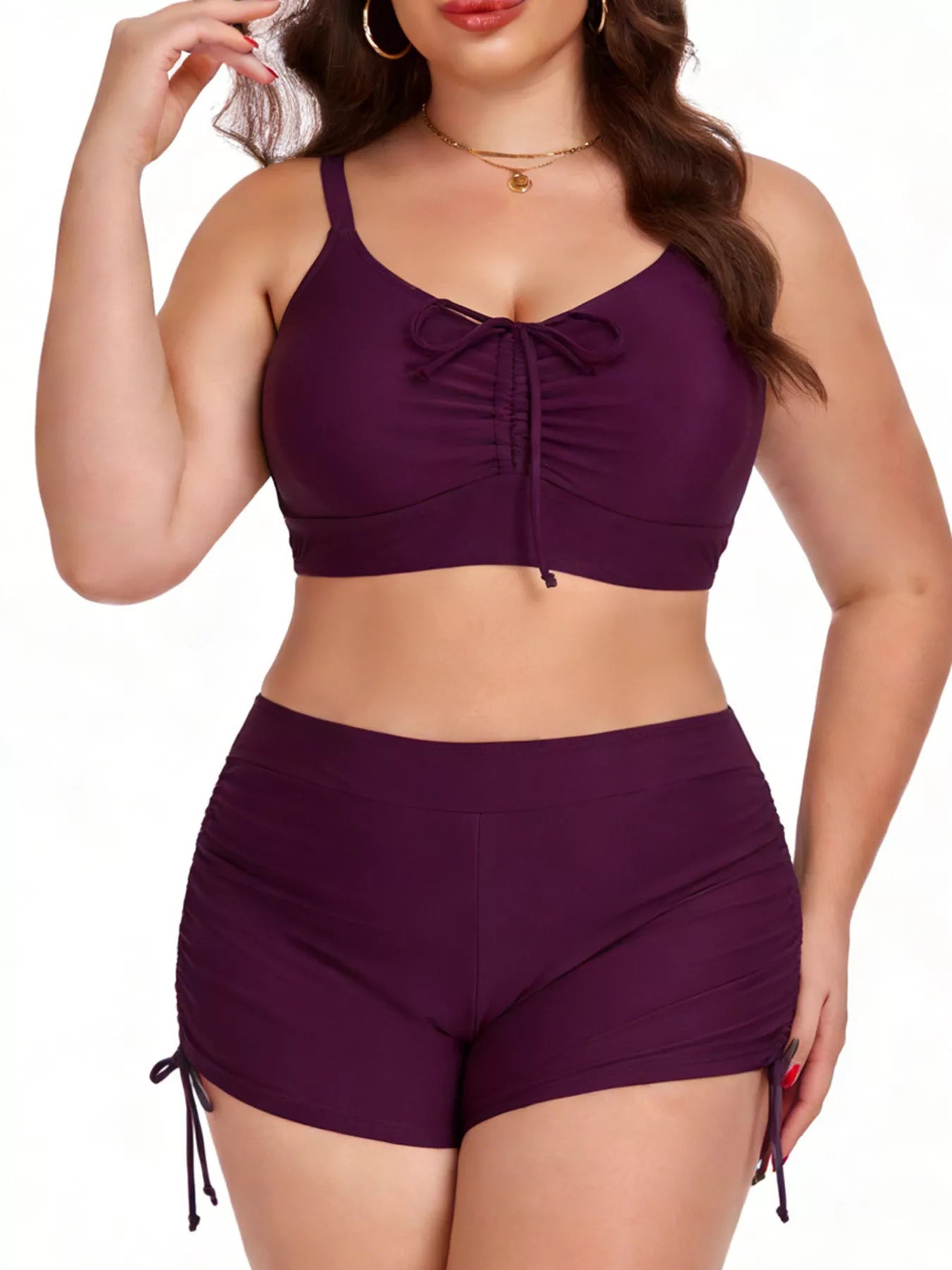 Woman wearing a purple bikini set on a white background
